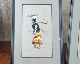 This lot features a pair of Native American paintings, likely depicting Apache Gaan dancers. Each piece measures in frame, 15” H x 10.25” W.