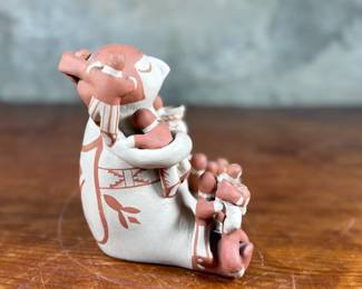 This lot features an original sculpture by listed Pueblo artist, Lupe Lucero Loretto. Signed underneath and measures, 5.25” H.