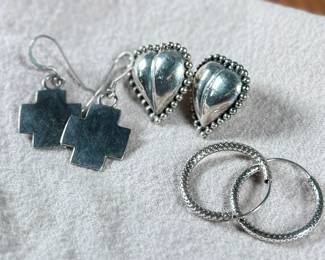 This lot features three (3) pairs of sterling silver earrings with a total approx. weight of 15.29 grams.