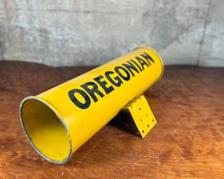 This lot features an original vintage newspaper holder with “OREGONIAN” written across.