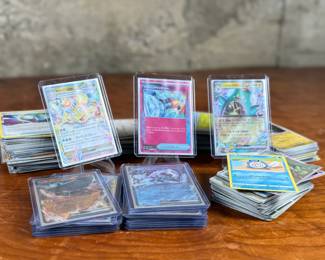 This lot features a large collection of Pokemon cards including both English & Japanese. Many holos and a good amount sleeved for protection.