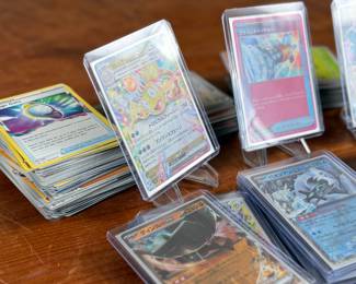 This lot features a large collection of Pokemon cards including both English & Japanese. Many holos and a good amount sleeved for protection.