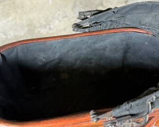 This lot features a beautiful antique Victorian-style doll carriage made from wicker, wood, and metal. This piece measures, 17.5” H x 19” W x 7” D.