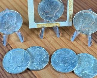 This lot features seven (7) 90% silver Kennedy half dollars.