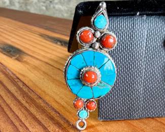 Silver earrings featuring circular design elements inlaid with turquoise and coral stones. The earrings have a post-back fastening with yellow rubber backs. Each features intricate detailing with multiple stone accents. Total approx. weight of 14.51 grams.