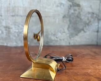 Jefferson ‘Golden Hour’ electric clock, manufactured by Jefferson Electric Company, Bellwood, Illinois. Features a brass-tone finish and an open-circle design with a 9” height. Operates using 110-120V AC, 2-5 watts. Includes plug-in cord. Tested and in working condition.