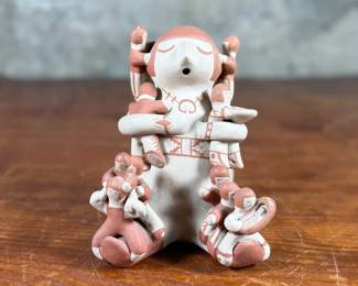 This lot features an original sculpture by listed Pueblo artist, Lupe Lucero Loretto. Signed underneath and measures, 5.25” H.