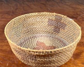 This lot features a Papago squash blossom basket from the early 20th century. Measures, 3.5” H x 9.25” W x 9.25” D.