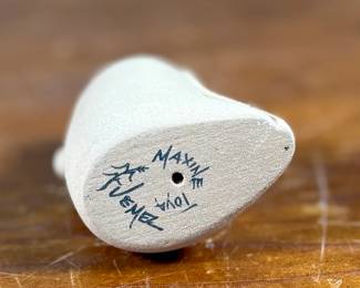 This lot features an original sculpture by listed artist, Maxine Toya and measures, 2.75” H.