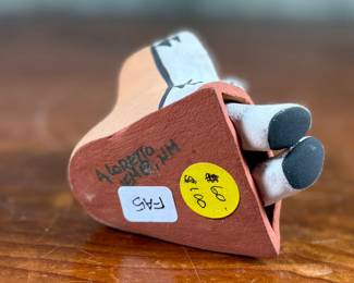 This lot features an original sculpture signed by artist, Loretto and measures, 3.25” H.