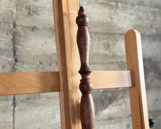 Brass bed warmer with floral etching and decorative perforations on the lid. The piece features a wooden turned handle with a rich patina and a hinged lid. The brass showcases signs of use with wear and age-related patina. The perforations were traditionally used for dispersing heat by placing warm materials inside the bed warmer. Suitable for collectors or historical display.