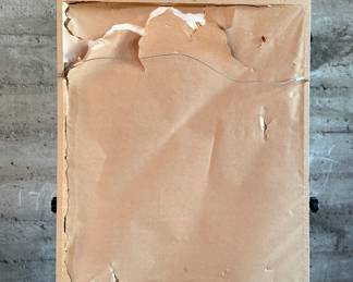 Framed portrait of a woman wearing a green headdress, depicted in a dark tonal palette. The artwork is presented in a wooden frame with white matting. The backing paper is torn, showing wear. Measures in frame, 28” H x 23” W.