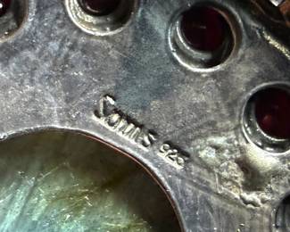 Sterling silver statement necklace featuring an intricate design with various gemstones. The hallmark ‘925’ is stamped on the reverse side, affirming its sterling silver composition. The piece includes multiple strands and pendants accented with gemstones. In good condition and designed with a secure clasp for wearability. This necklace measures, 18” with a total approx. weight of 356.22 grams.