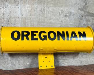 This lot features an original vintage newspaper holder with “OREGONIAN” written across.