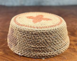 This lot features a Papago squash blossom basket from the early 20th century. Measures, 3.5” H x 9.25” W x 9.25” D.