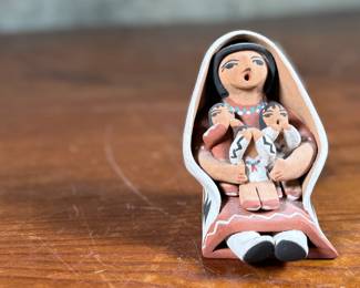 This lot features an original sculpture signed by artist, Loretto and measures, 3.25” H.