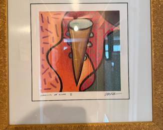framed limited edition artwork titled "Looking at Glass II" by Brazilian pop artist Romero Britto. 