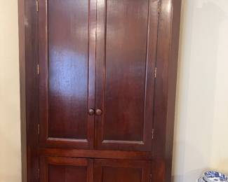 Cherry corner cabinet blind doors