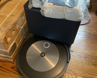 Modern Roomba with extra bags, filters etc