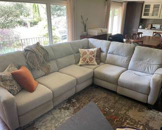 Modern grey sectional with one recliner