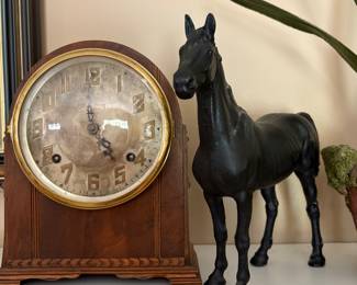 Mantel clock and heavy horse