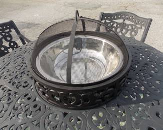 Black metal table with 4 chairs, fire pit and ice holder or just use umbrella