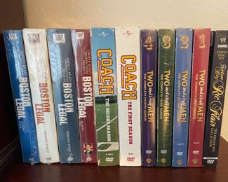A boatload of DVD sets . Most are still wrapped NEW IN THE BOX