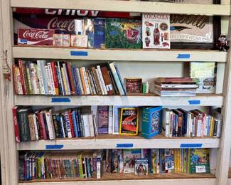 Kids and adults books and Coca Cola signs 