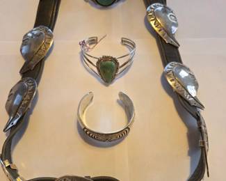 Sterling silver bear concho belt; three sterling cuff bracelets