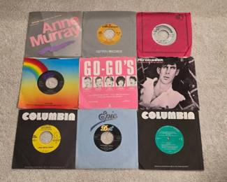 Nine 7-Inch Vinyl RecordsFeaturing Various Artists