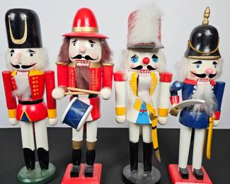 Lot #121 - Set of 4 Vintage Wooden Nutcracker Soldiers – Classic Hand-Painted Holiday Decorations with Drummer and Guardsman Figures