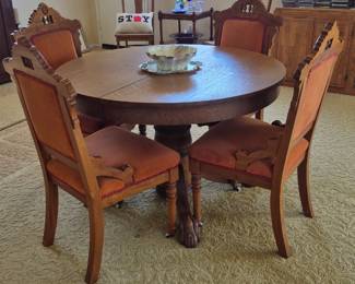 Antique dining table with 5 chairs