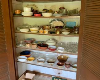 an array of vintage dishes and serving items