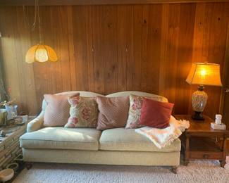 modern sofa; vintage yellow hanging lamp