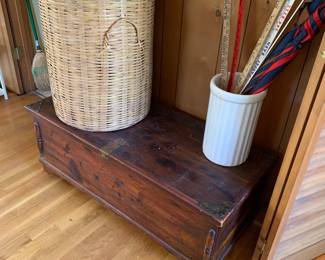 cedar chest; large rattan hamper; umbrella stand