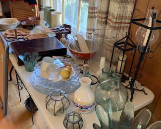 assorted glass; black iron candle holders