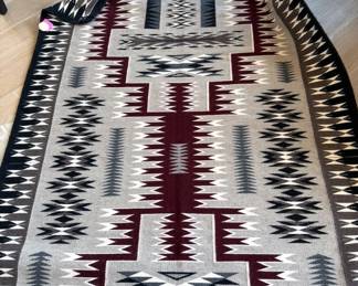 Navajo rug with storm pattern,  89” x 56”