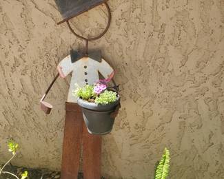 Metal garden buddy and plant 