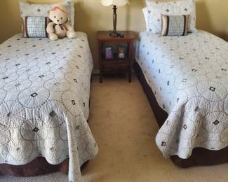 Twin beds, new bedding; w/night table 
