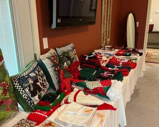 A wall mounted TV in almost every room