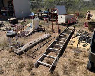 Hand truck, stool, rake, metal cart under wood box