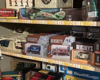 Collection of Hershey's American Highway Legends die cast metal model trucks, Keystone "Ride Em" Fighter Plane and Beefeaters toy soldier set.