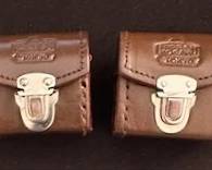 Vintage Nikon Nippon Kogaku external viewfinders with leather cases.