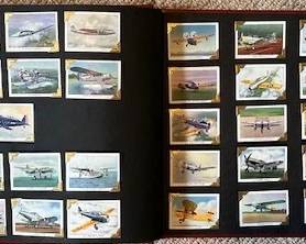 Vintage collection of 1943 Coca-Cola "America's Fighting Planes in Action" promotional cards featuring World War II military aircraft illustrations.