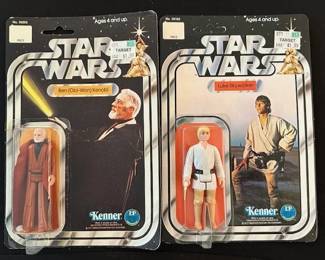 1977 Kenner Star Wars Obi-Wan Kenobi action figure and 1977 Kenner Star Wars Luke Skywalker action figures in original packaging.