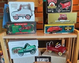 Collection of die-cast pedal car replicas by "Kiddie Car Classics" and Texaco brand vehicles.