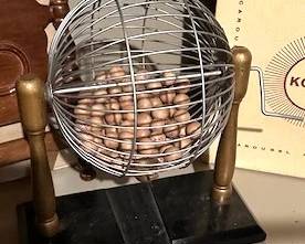 Antique Bingo cage with numbered balls.