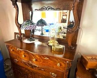 Gorgeous Victorian-Style quarter sawn oak sideboard with beveled mirror and carved floarl design.