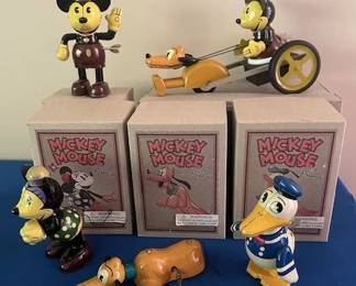 Vintage Schulling reproduction Disney Mickey Mouse and Friends tin wind-up toys, (2002).