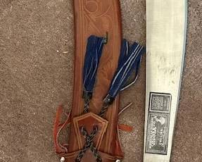 Vintage Collins & Co. machete with leather sheath.